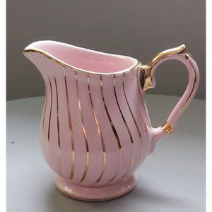 Vintage (1930s) Sadler creamer in pink with gold gilding. Made in England.